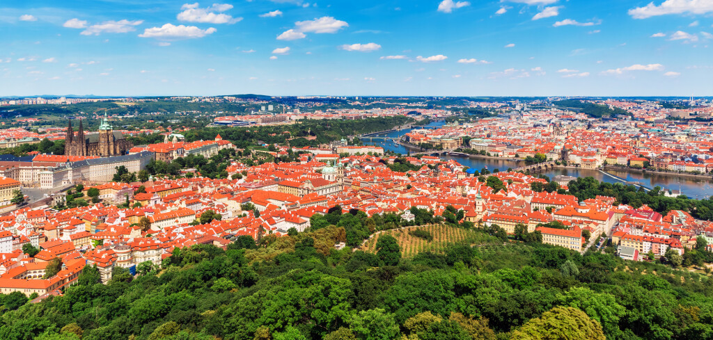 Scenic summer aerial panorama of the Old Town architecture in Prague, Czech Republic with Saint Vitus Cathedral, Vltava River and Charles Bridge