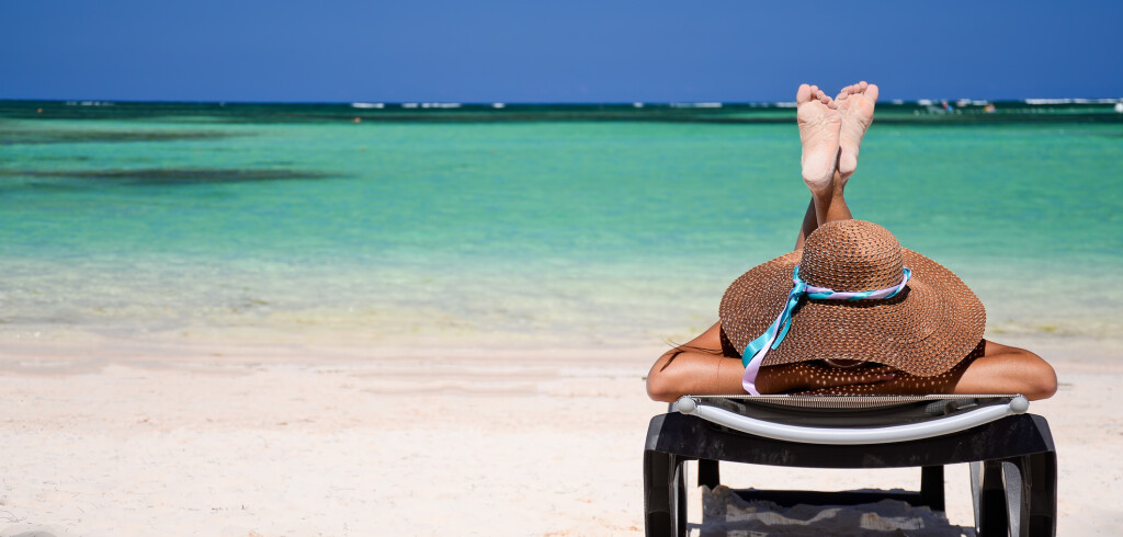 Young woman relaxing on beach, healthy lifestyle and freedom conception