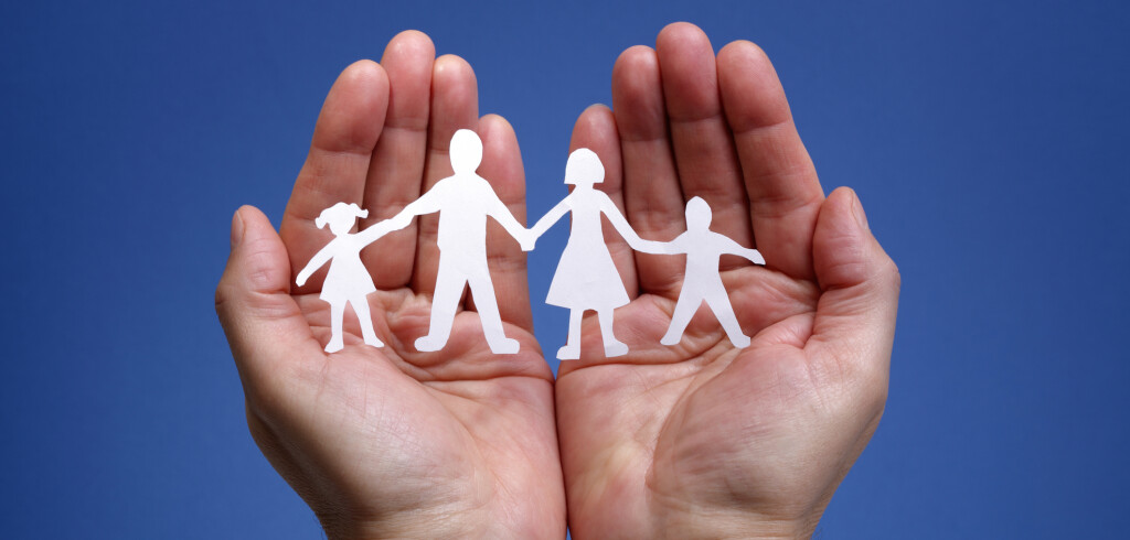 Cutout paper chain family with the protection of cupped hands, concept for security and care