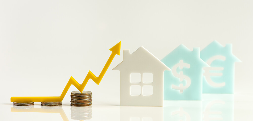 Real estate market, graph, up arrow. House model and a stack of coins. The concept of inflation, economic growth, the price of insurance services. Copy space