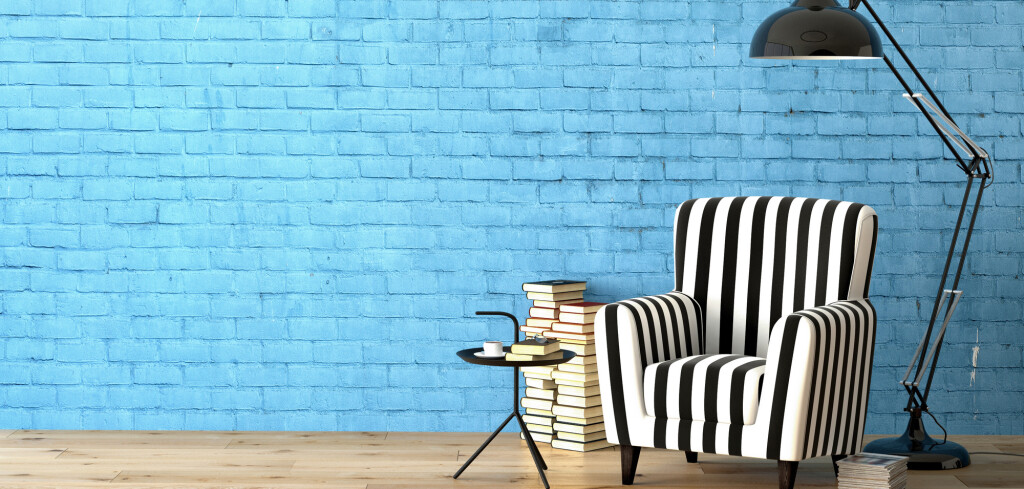 living room with an armchair, lamp and books, 3d rendering